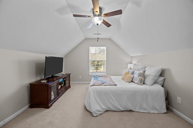 carpeted bedroom featuring lofted ceiling, ceiling fan, and baseboards