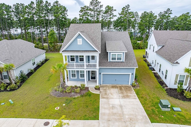 view of front facade with a front yard and a garage