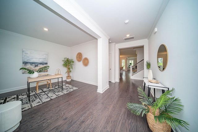 hallway with crown molding and dark hardwood / wood-style floors