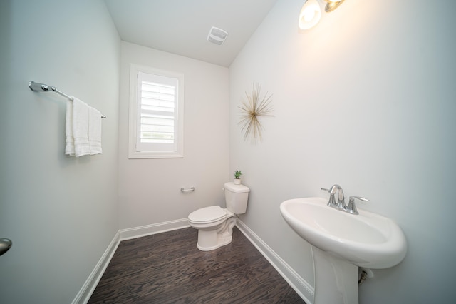 bathroom featuring toilet and hardwood / wood-style floors