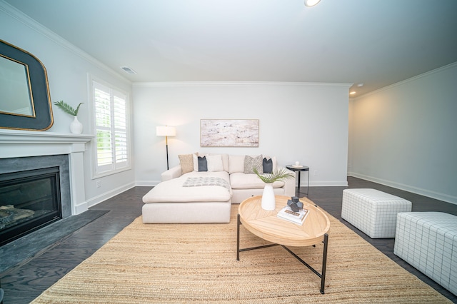 living room featuring ornamental molding, a high end fireplace, and dark hardwood / wood-style flooring