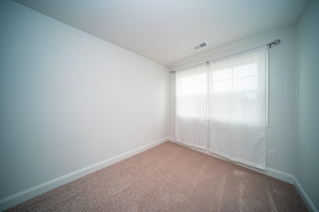 spare room with carpet floors