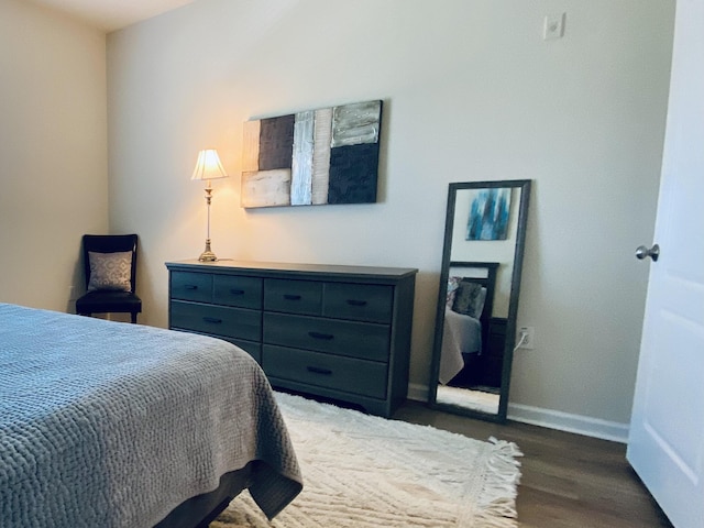 bedroom featuring dark hardwood / wood-style floors