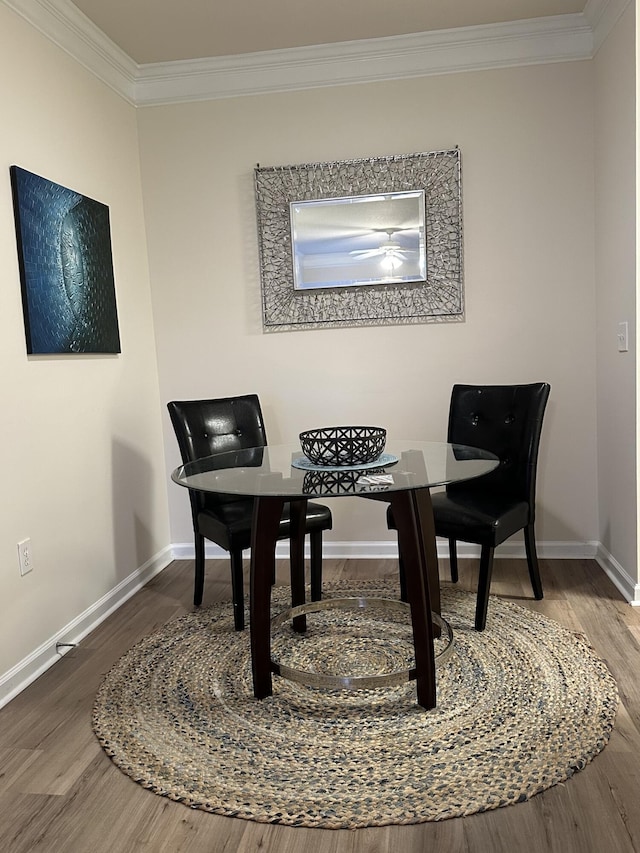 sitting room featuring hardwood / wood-style flooring and ornamental molding