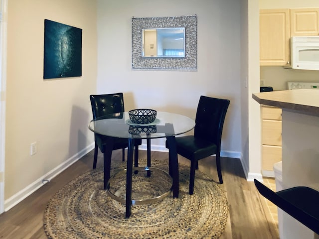 dining room featuring dark hardwood / wood-style floors