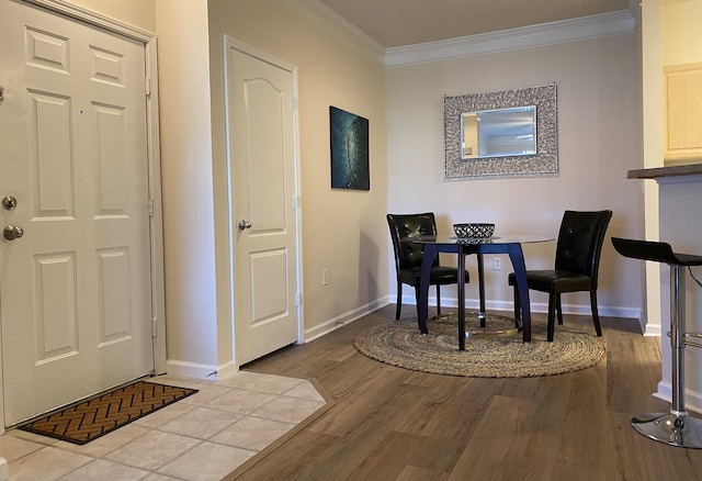 dining room featuring crown molding and hardwood / wood-style floors