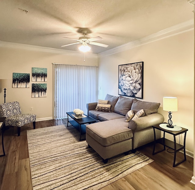 living room featuring crown molding, ceiling fan, hardwood / wood-style floors, and a textured ceiling