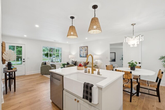 521 Carpenter St, Charleston, SC 29412 - kitchen with dishwasher, a sink, light wood finished floors, hanging light fixtures, and recessed lighting