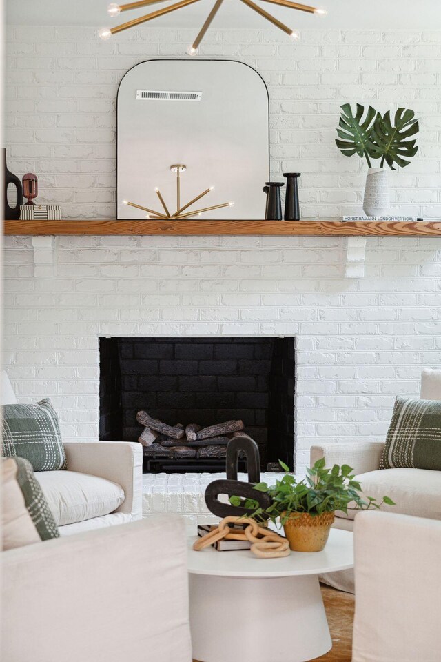 521 Carpenter St, Charleston, SC 29412 - living room featuring a brick fireplace and brick wall