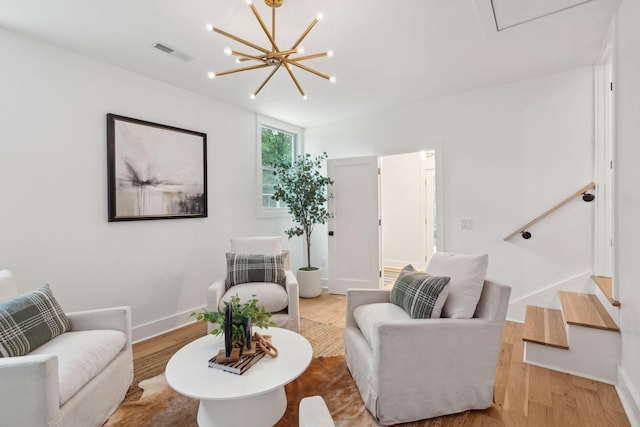 521 Carpenter St, Charleston, SC 29412 - living area featuring wood finished floors, a chandelier, and baseboards