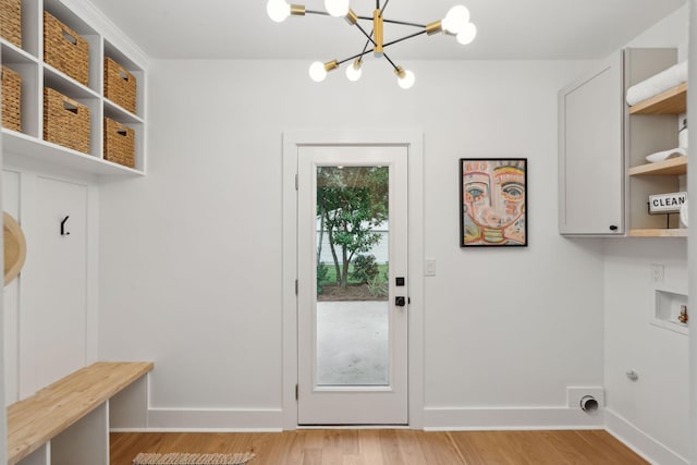 521 Carpenter St, Charleston, SC 29412 - laundry room featuring a chandelier, light wood-style flooring, hookup for a washing machine, and baseboards