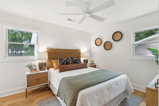 521 Carpenter St, Charleston, SC 29412 - bedroom with light wood-style floors, baseboards, and a ceiling fan