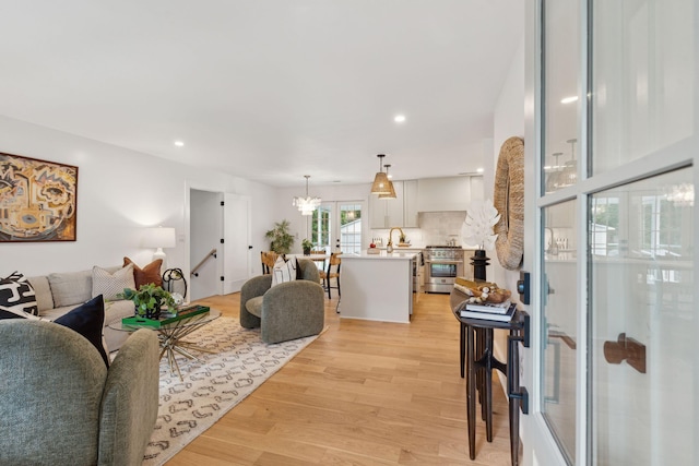 521 Carpenter St, Charleston, SC 29412 - living area featuring light wood-style flooring, recessed lighting, and a chandelier