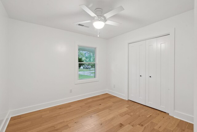 521 Carpenter St, Charleston, SC 29412 - unfurnished bedroom with light wood-style floors, baseboards, a closet, and ceiling fan