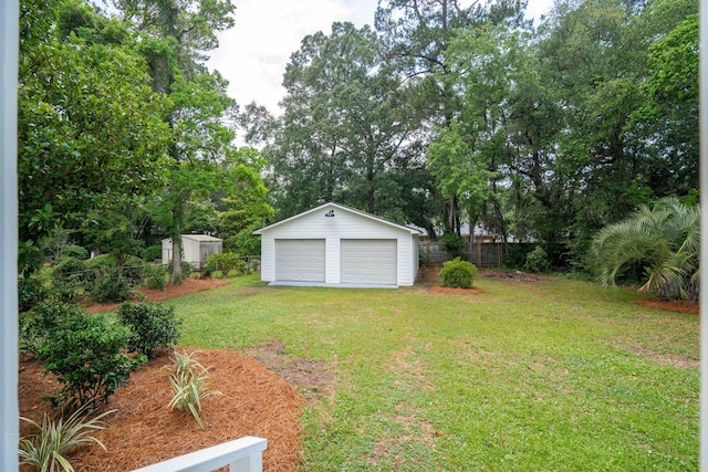 521 Carpenter St, Charleston, SC 29412 - view of yard featuring a detached garage, an outdoor structure, and view of scattered trees