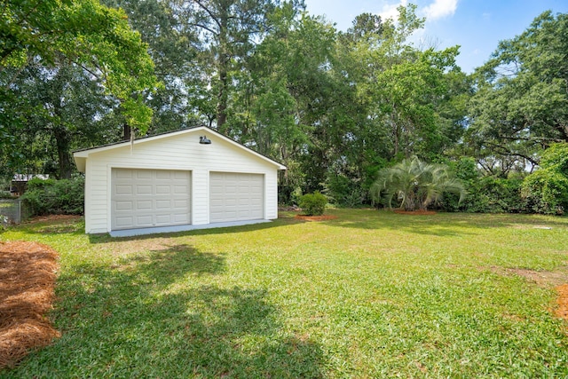 521 Carpenter St, Charleston, SC 29412 - view of grassy yard with an outbuilding, a garage, and view of scattered trees