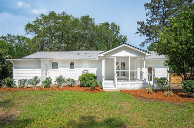 521 Carpenter St, Charleston, SC 29412 - single story home featuring a porch, a front yard, and brick siding