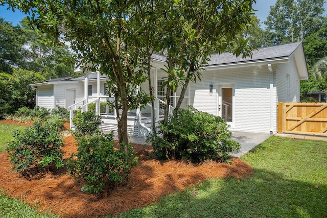 521 Carpenter St, Charleston, SC 29412 - rear view of house with brick siding and a porch