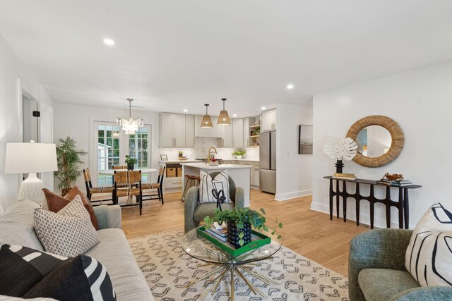 521 Carpenter St, Charleston, SC 29412 - living room featuring a chandelier, light wood finished floors, recessed lighting, and baseboards