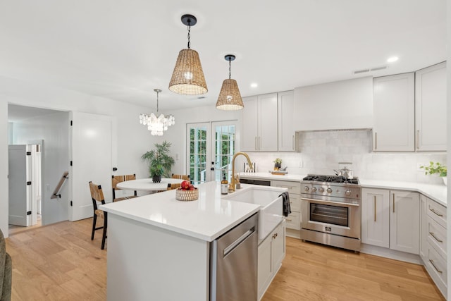 521 Carpenter St, Charleston, SC 29412 - kitchen featuring stainless steel appliances, backsplash, light countertops, a sink, and recessed lighting