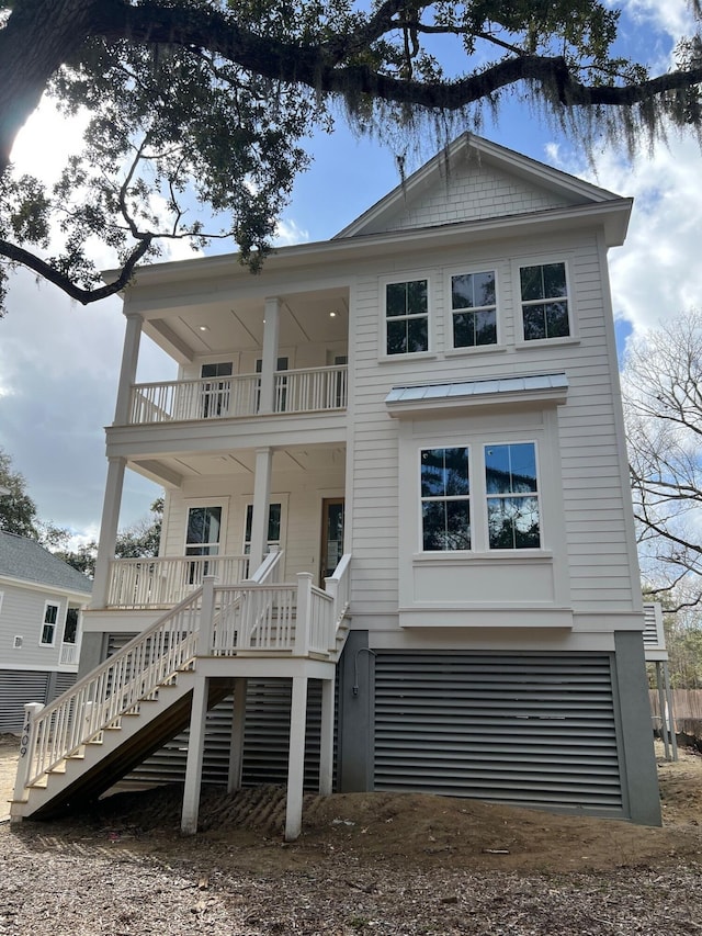 view of front of house with a porch and a balcony