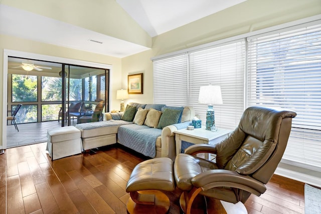 living room with ceiling fan, lofted ceiling, and dark hardwood / wood-style floors