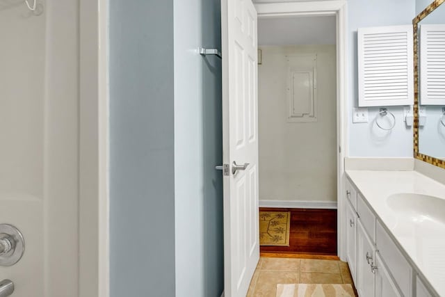 bathroom with tile patterned floors and vanity