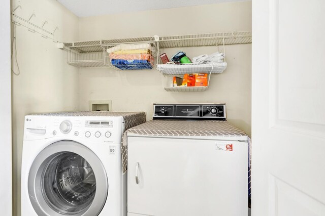 laundry room with separate washer and dryer