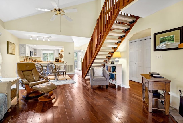 living room with high vaulted ceiling, dark wood-type flooring, and ceiling fan