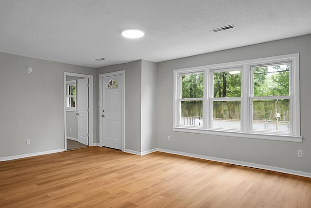 5056 Piedmont Ave, North Charleston, SC 29406 - foyer entrance with light wood-style floors and baseboards