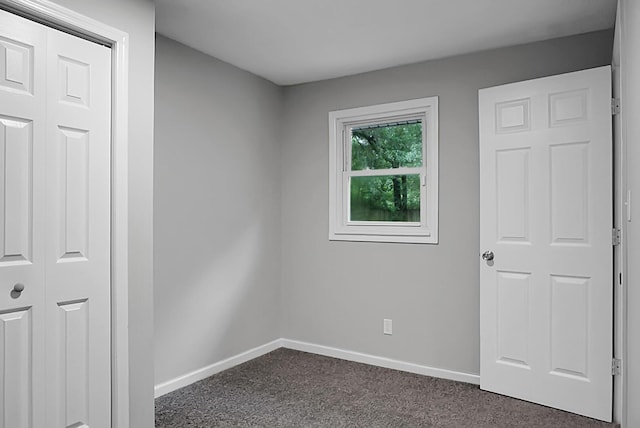5056 Piedmont Ave, North Charleston, SC 29406 - unfurnished bedroom featuring dark colored carpet and baseboards
