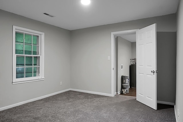 5056 Piedmont Ave, North Charleston, SC 29406 - spare room featuring carpet and baseboards