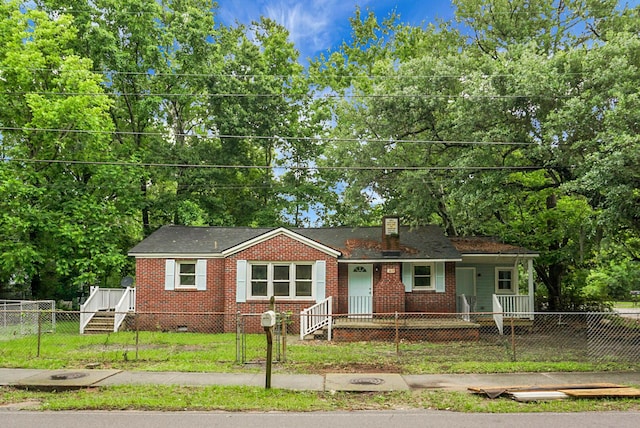5056 Piedmont Ave, North Charleston, SC 29406 - view of front of property with a fenced front yard, covered porch, crawl space, and a chimney