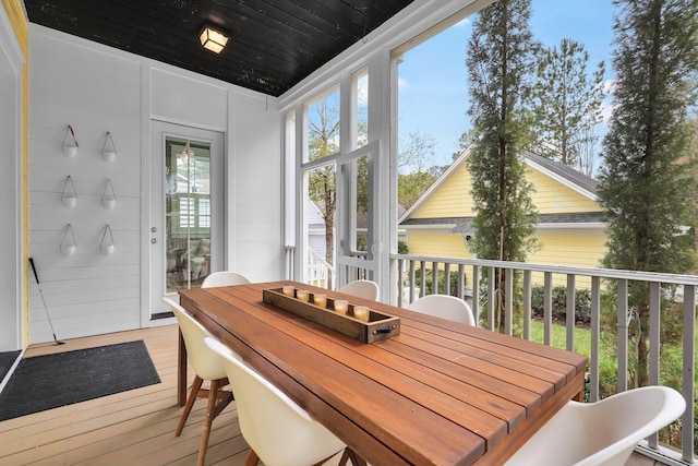 sunroom / solarium featuring wooden ceiling