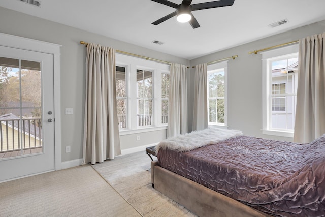 bedroom featuring access to exterior, baseboards, visible vents, and carpet flooring