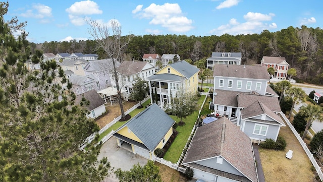 birds eye view of property with a residential view and a view of trees