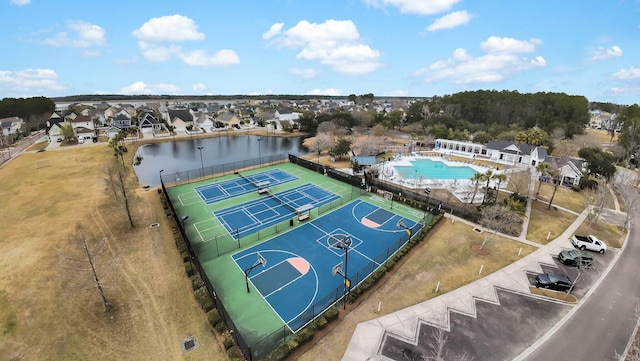 drone / aerial view with a water view and a residential view