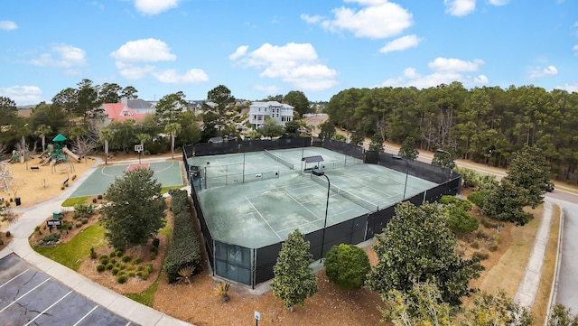 view of tennis court with fence