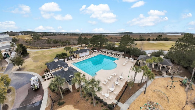 community pool featuring a patio, area for grilling, and fence