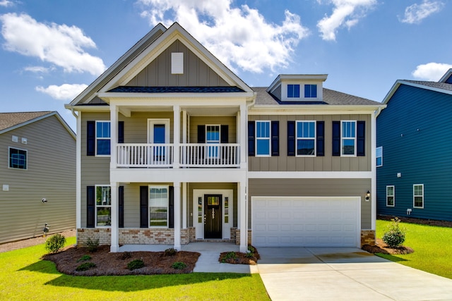 craftsman-style home with a garage, a front yard, and a balcony