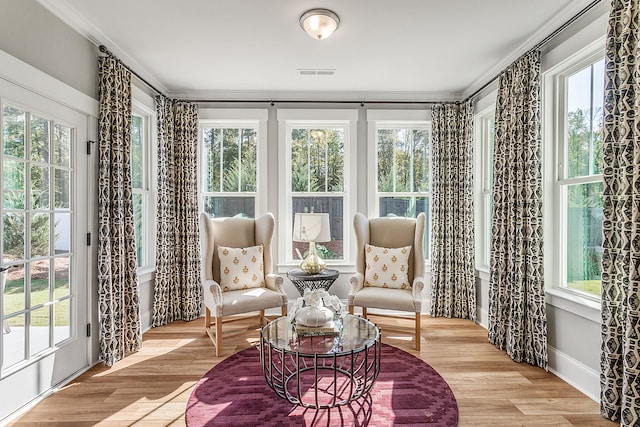 sitting room with a healthy amount of sunlight and light hardwood / wood-style flooring