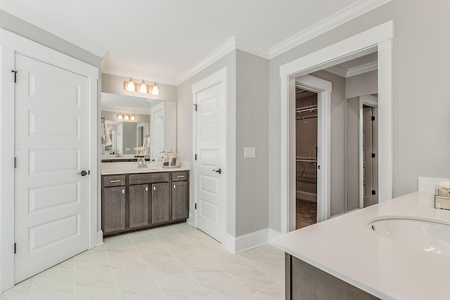 bathroom with tile flooring, ornamental molding, and large vanity