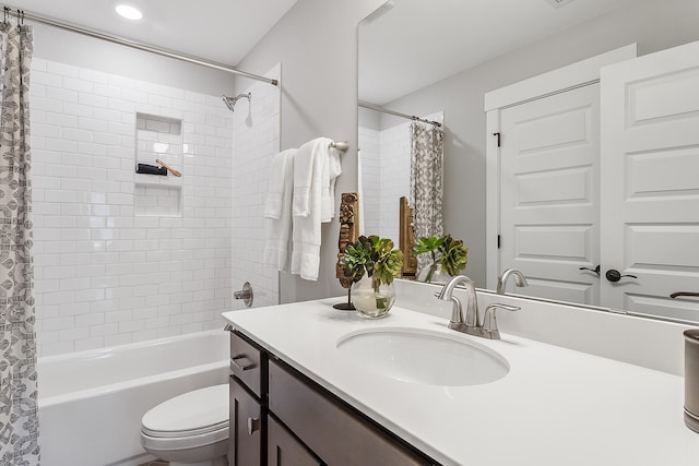 full bathroom with toilet, shower / tub combo with curtain, and oversized vanity