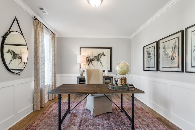 office with a wealth of natural light, hardwood / wood-style floors, and ornamental molding