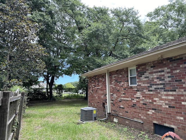 view of yard featuring central air condition unit