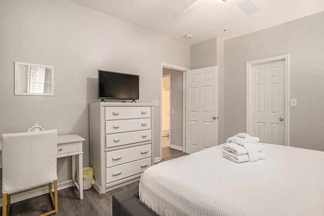 bedroom featuring dark hardwood / wood-style flooring and ceiling fan