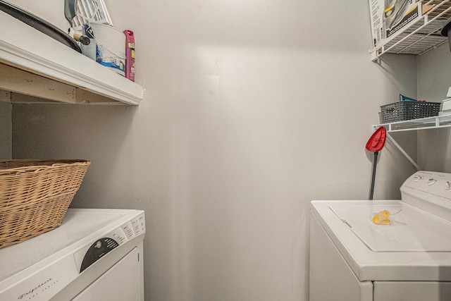 laundry room featuring washer and clothes dryer