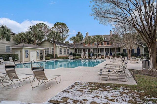 view of swimming pool with a patio area