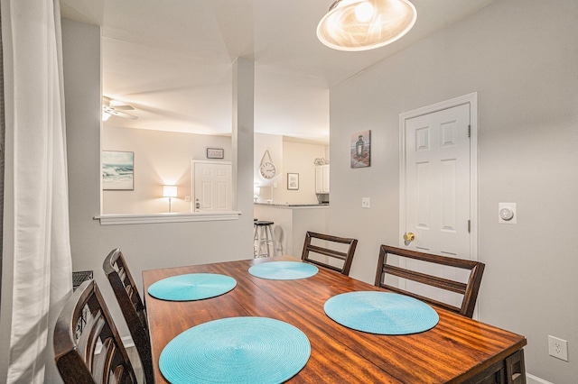 dining space featuring ceiling fan