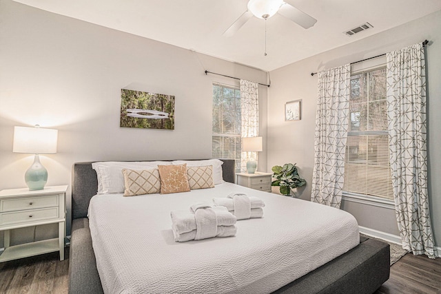 bedroom featuring dark hardwood / wood-style flooring and ceiling fan